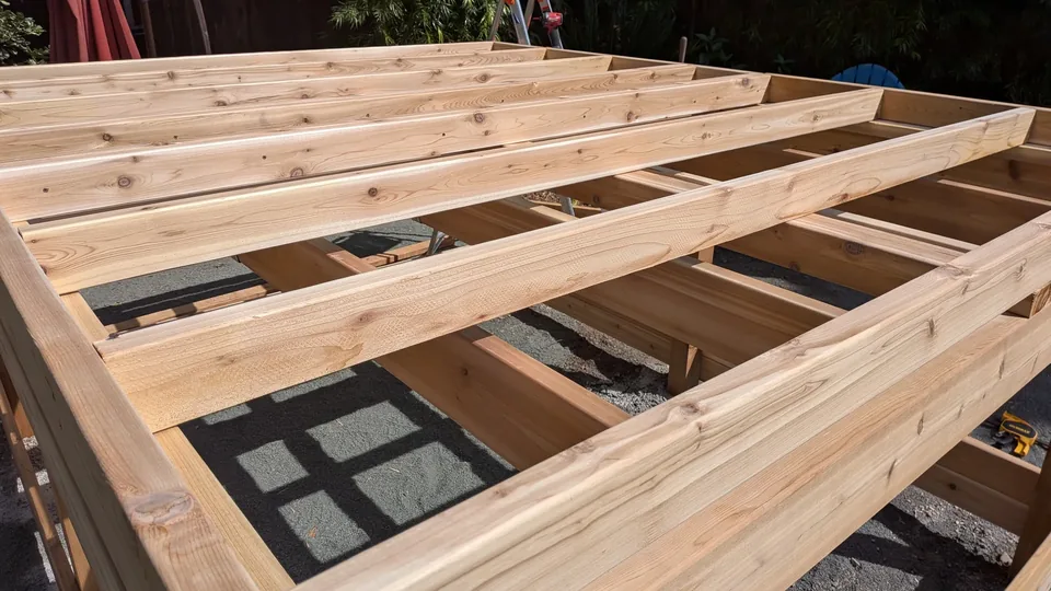 Supporting timber frame during the May 2026 raised playhouse assembly