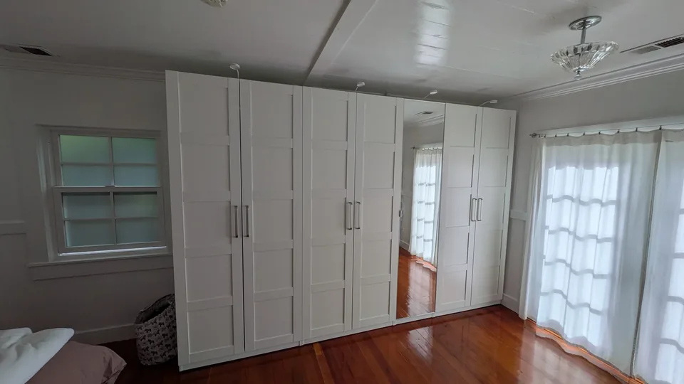Completed white wardrobe with mirrored doors